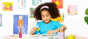 Child practicing ABA therapy activities with picture cards to build learning skills.