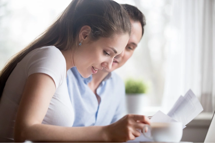 ABA therapy insurance coverage guide for parents reviewing paperwork and plan details at home