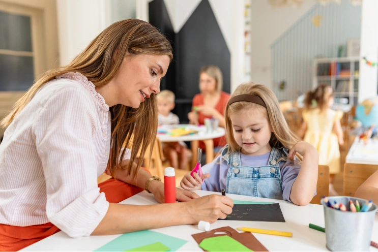 RBT supervision requirements guide showing an ABA professional supporting a child during a learning activity.